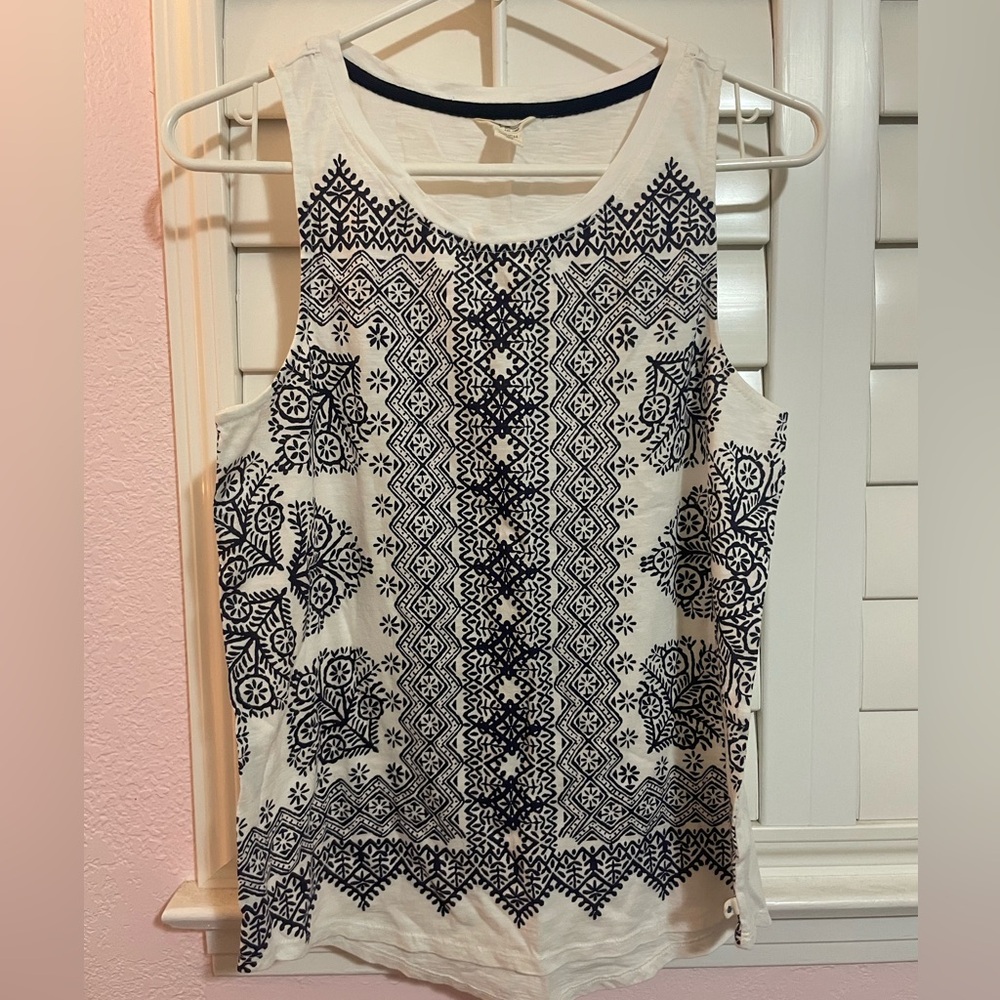 Lucky Brand white Tank Top with blue floral pattern on the front.